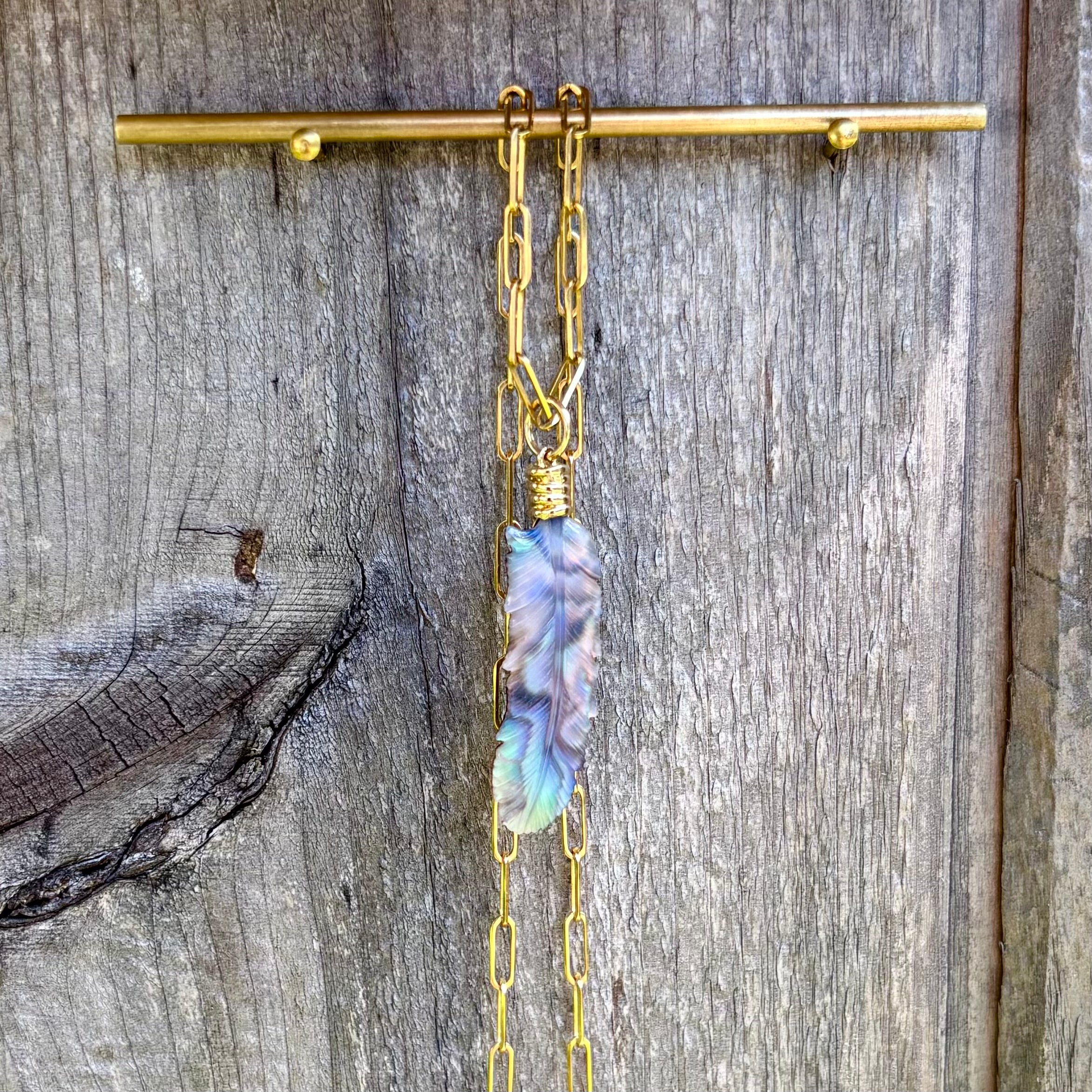 Luminescent Feather Charm
